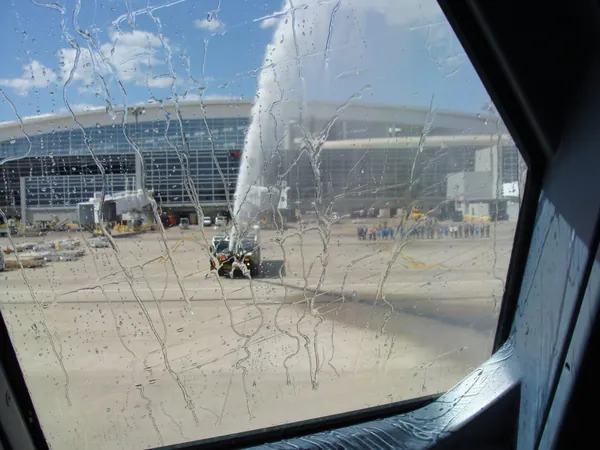 Traditional salut on celebratory flights by the Dallas, Texas Airport Fire Department. First flight of the summer season and the appreciation of the very friendly Americans is always high.